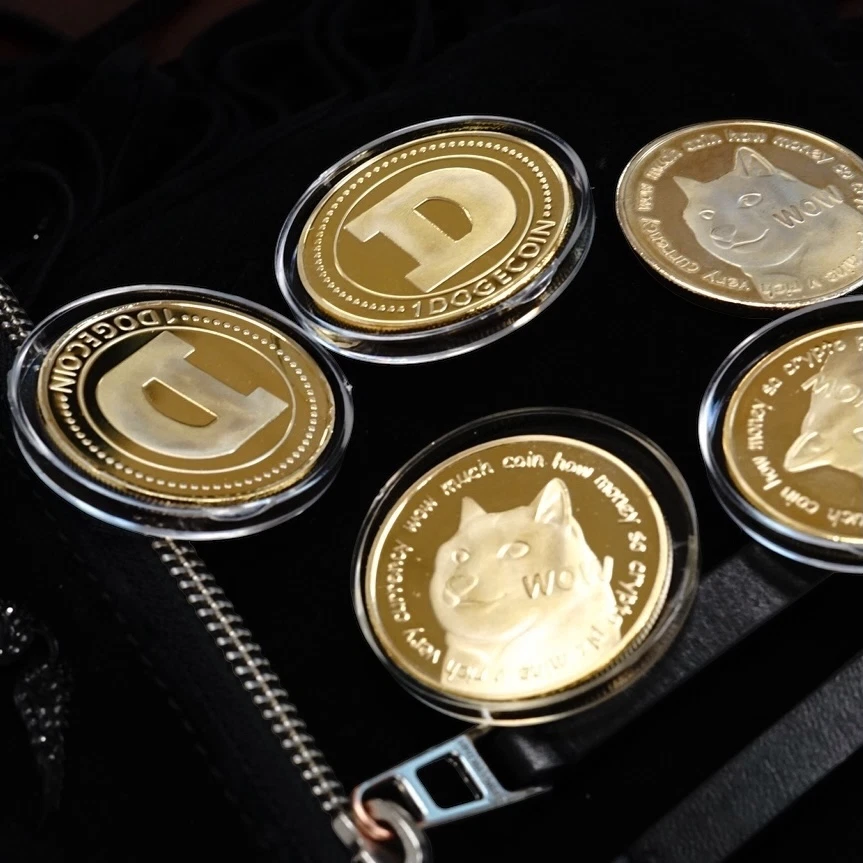 Gold Dogecoin collectible coins displayed on black felt, great as a gift